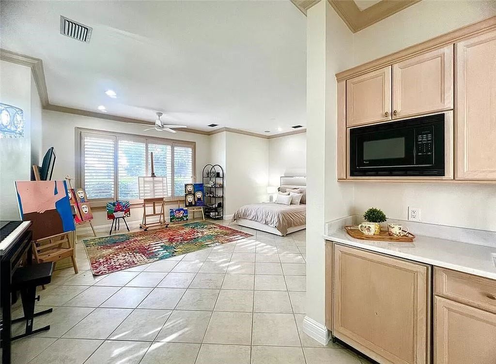 Welcome to Sunspray Estate, an exquisite 5-bedroom masterpiece nestled along the shores of a secluded spring-fed lake in Naples, Florida.