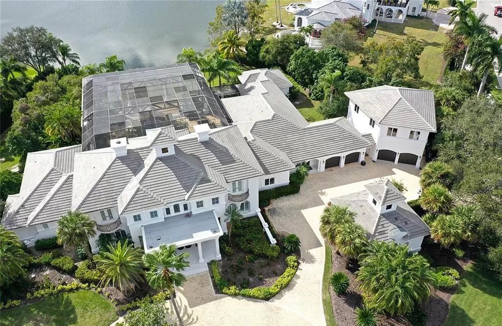Welcome to Sunspray Estate, an exquisite 5-bedroom masterpiece nestled along the shores of a secluded spring-fed lake in Naples, Florida.