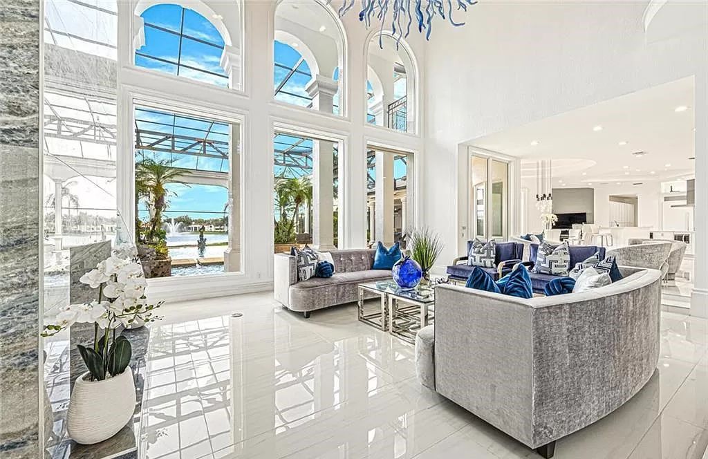 Welcome to Sunspray Estate, an exquisite 5-bedroom masterpiece nestled along the shores of a secluded spring-fed lake in Naples, Florida.