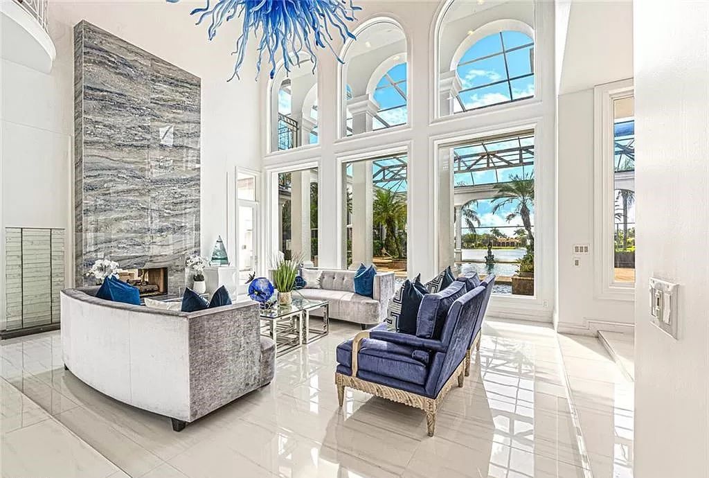 Welcome to Sunspray Estate, an exquisite 5-bedroom masterpiece nestled along the shores of a secluded spring-fed lake in Naples, Florida.