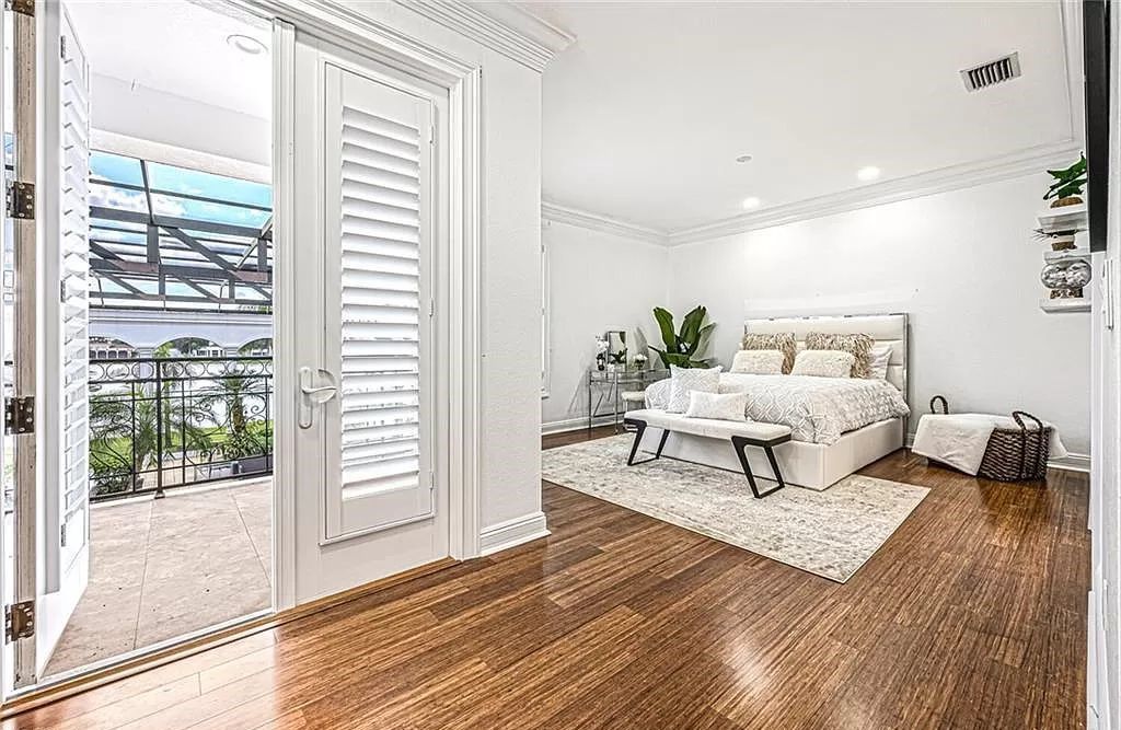 Welcome to Sunspray Estate, an exquisite 5-bedroom masterpiece nestled along the shores of a secluded spring-fed lake in Naples, Florida.