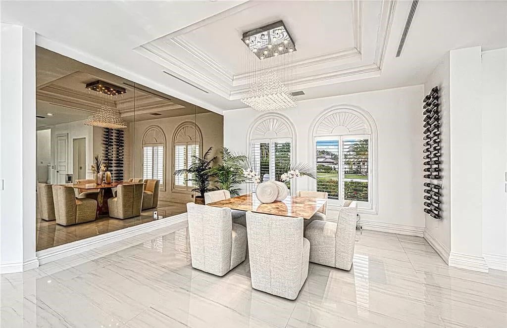 Welcome to Sunspray Estate, an exquisite 5-bedroom masterpiece nestled along the shores of a secluded spring-fed lake in Naples, Florida.