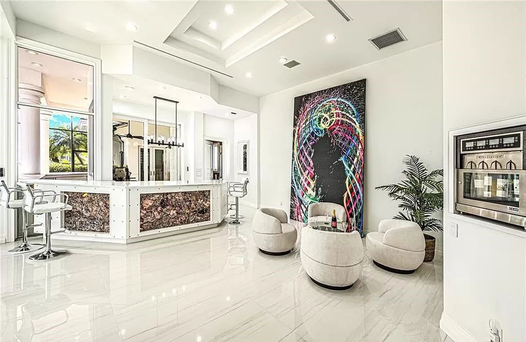 Welcome to Sunspray Estate, an exquisite 5-bedroom masterpiece nestled along the shores of a secluded spring-fed lake in Naples, Florida.