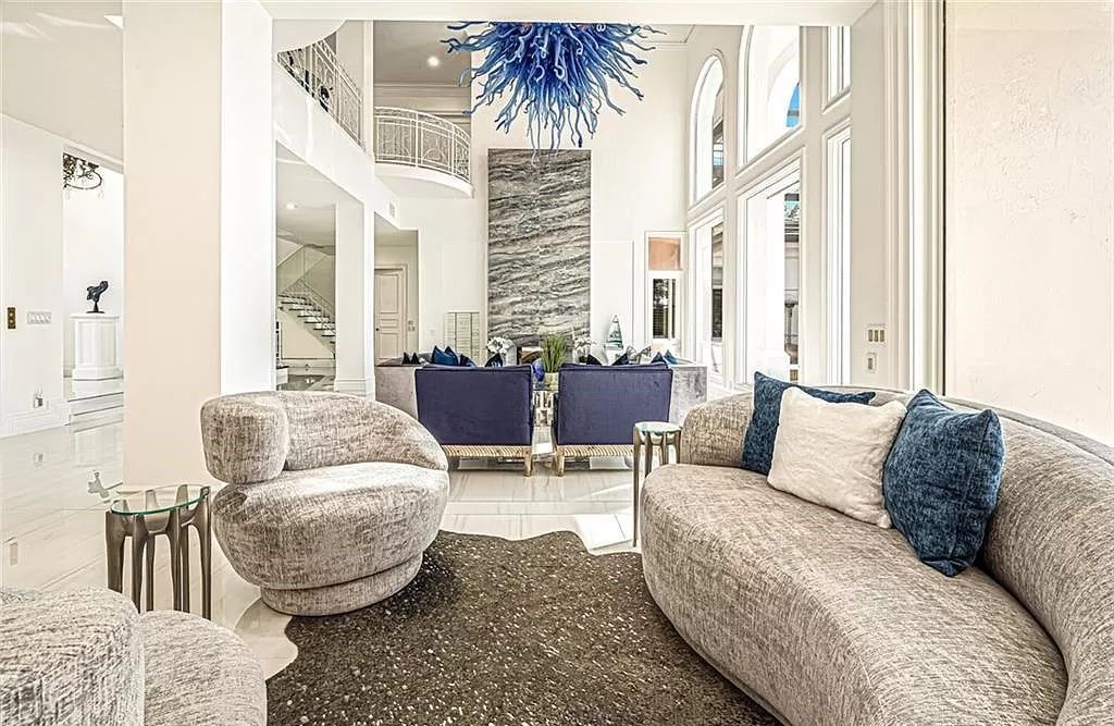 Welcome to Sunspray Estate, an exquisite 5-bedroom masterpiece nestled along the shores of a secluded spring-fed lake in Naples, Florida.