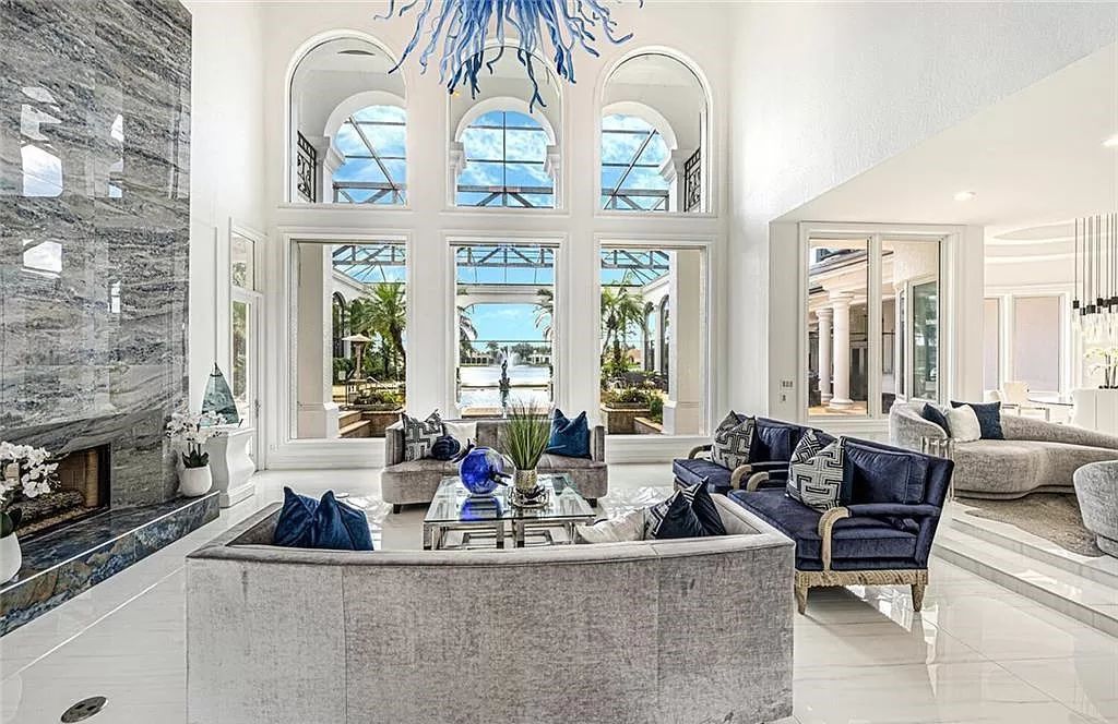 Welcome to Sunspray Estate, an exquisite 5-bedroom masterpiece nestled along the shores of a secluded spring-fed lake in Naples, Florida.
