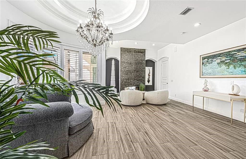 Welcome to Sunspray Estate, an exquisite 5-bedroom masterpiece nestled along the shores of a secluded spring-fed lake in Naples, Florida.