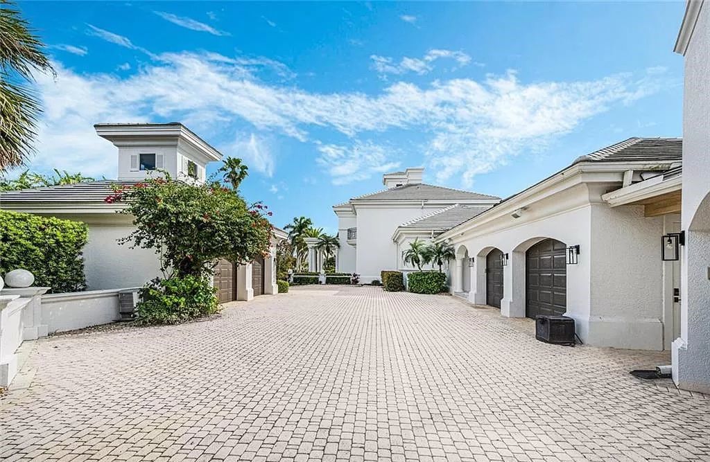 Welcome to Sunspray Estate, an exquisite 5-bedroom masterpiece nestled along the shores of a secluded spring-fed lake in Naples, Florida.