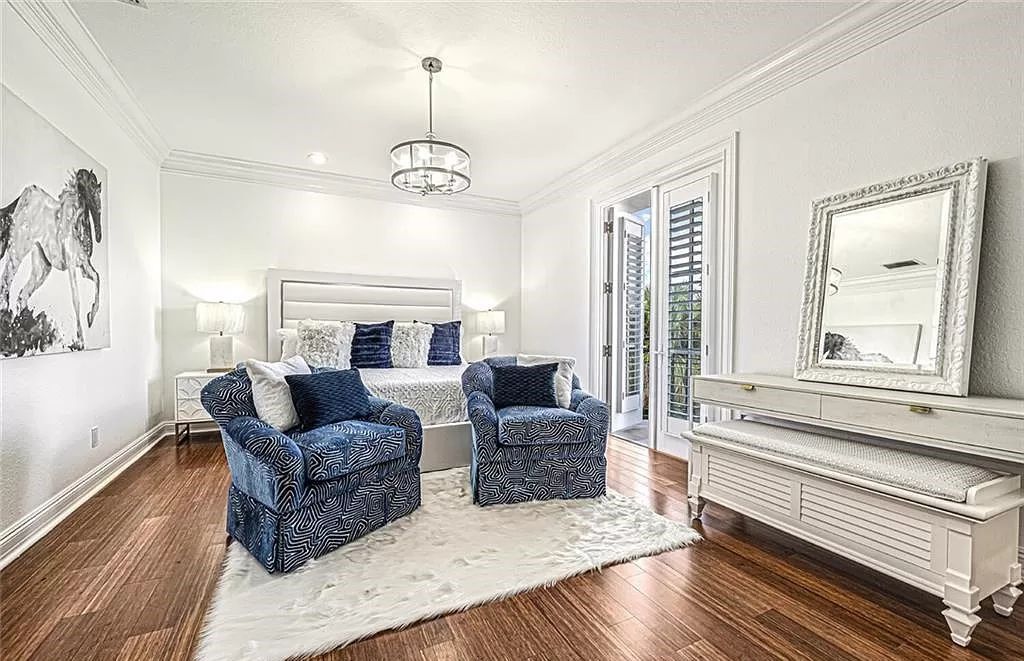Welcome to Sunspray Estate, an exquisite 5-bedroom masterpiece nestled along the shores of a secluded spring-fed lake in Naples, Florida.