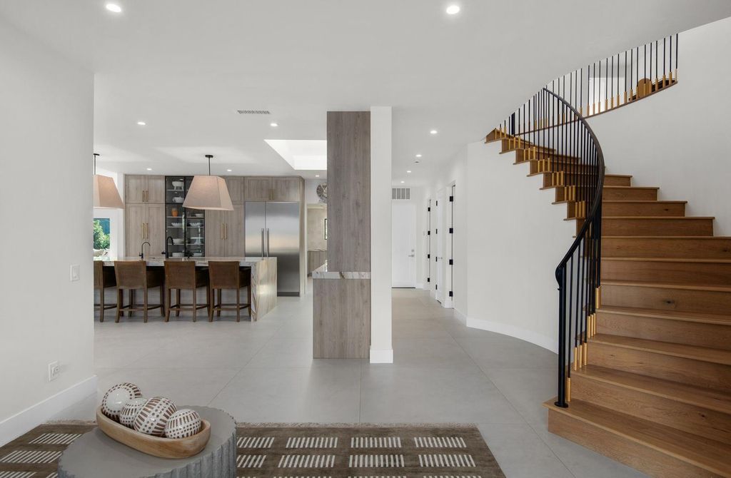 6665 Via Estrada Home in La Jolla, California. Step into the lap of luxury with this opulent residence in La Jolla, boasting over 6,000 square feet of meticulously designed space. Immerse yourself in sophistication with six en suite bedrooms, high-end finishes, and grand living areas.