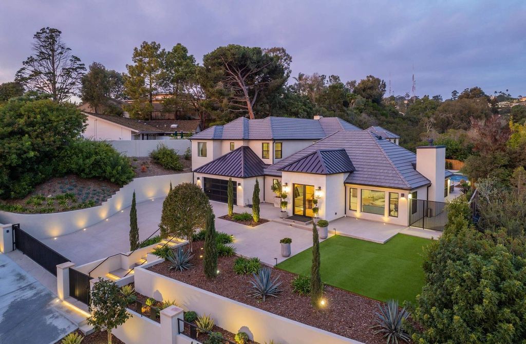 6665 Via Estrada Home in La Jolla, California. Step into the lap of luxury with this opulent residence in La Jolla, boasting over 6,000 square feet of meticulously designed space. Immerse yourself in sophistication with six en suite bedrooms, high-end finishes, and grand living areas.