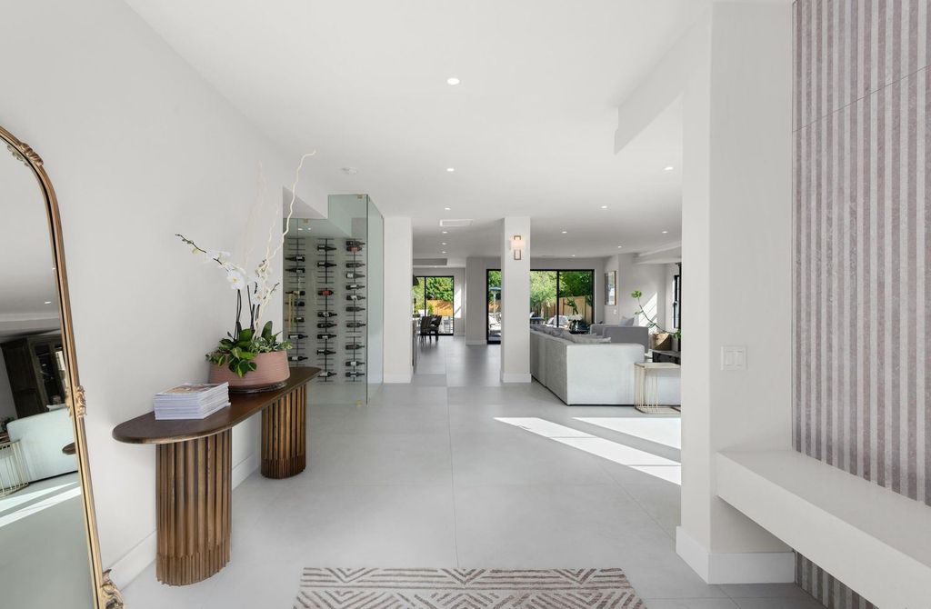 6665 Via Estrada Home in La Jolla, California. Step into the lap of luxury with this opulent residence in La Jolla, boasting over 6,000 square feet of meticulously designed space. Immerse yourself in sophistication with six en suite bedrooms, high-end finishes, and grand living areas.