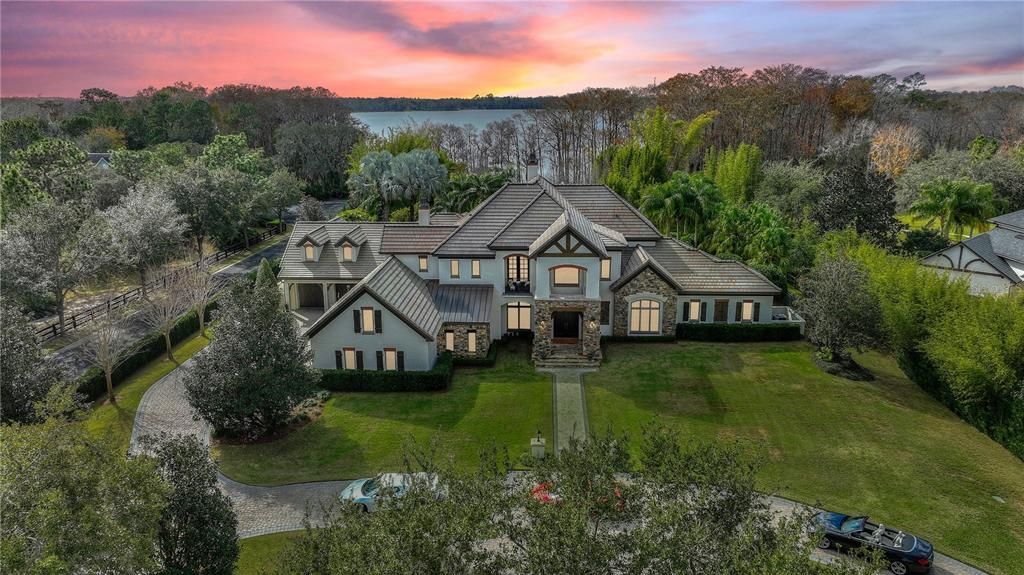 Named "Millionaires Cove," this Tudor Tuscan marvel blends Balinese and Indian influences. The gated community, housing only 29 residences, with 10 enjoying private lake access, ensures exclusive serenity.