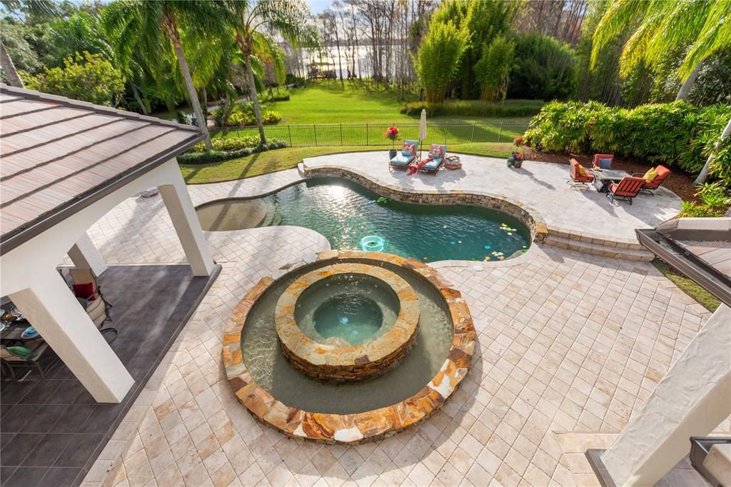 Named "Millionaires Cove," this Tudor Tuscan marvel blends Balinese and Indian influences. The gated community, housing only 29 residences, with 10 enjoying private lake access, ensures exclusive serenity.