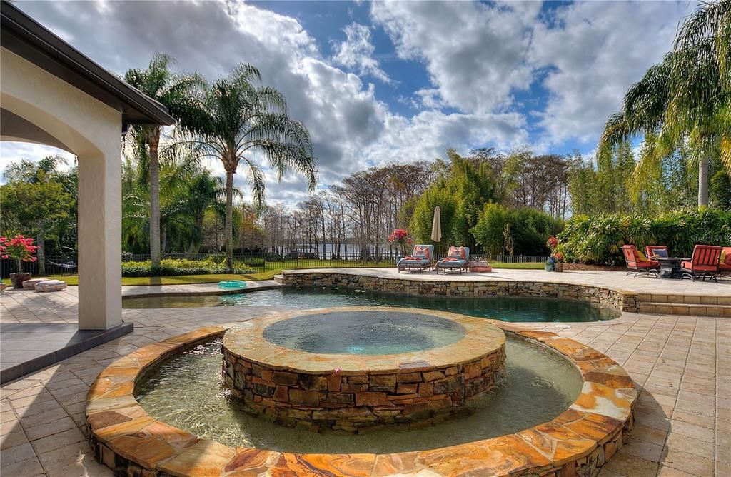 Named "Millionaires Cove," this Tudor Tuscan marvel blends Balinese and Indian influences. The gated community, housing only 29 residences, with 10 enjoying private lake access, ensures exclusive serenity.