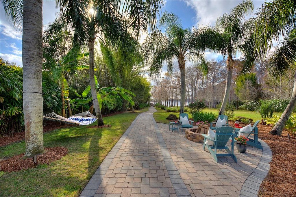 Named "Millionaires Cove," this Tudor Tuscan marvel blends Balinese and Indian influences. The gated community, housing only 29 residences, with 10 enjoying private lake access, ensures exclusive serenity.