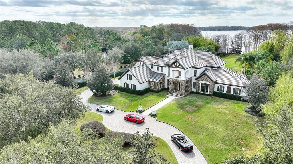 Named "Millionaires Cove," this Tudor Tuscan marvel blends Balinese and Indian influences. The gated community, housing only 29 residences, with 10 enjoying private lake access, ensures exclusive serenity.