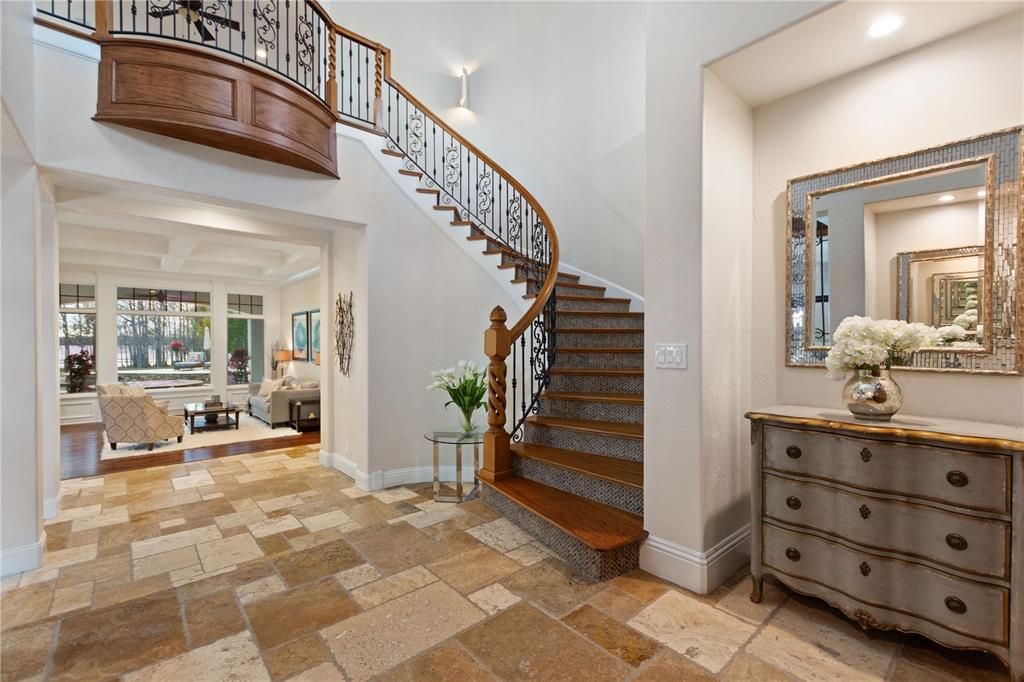 Named "Millionaires Cove," this Tudor Tuscan marvel blends Balinese and Indian influences. The gated community, housing only 29 residences, with 10 enjoying private lake access, ensures exclusive serenity.