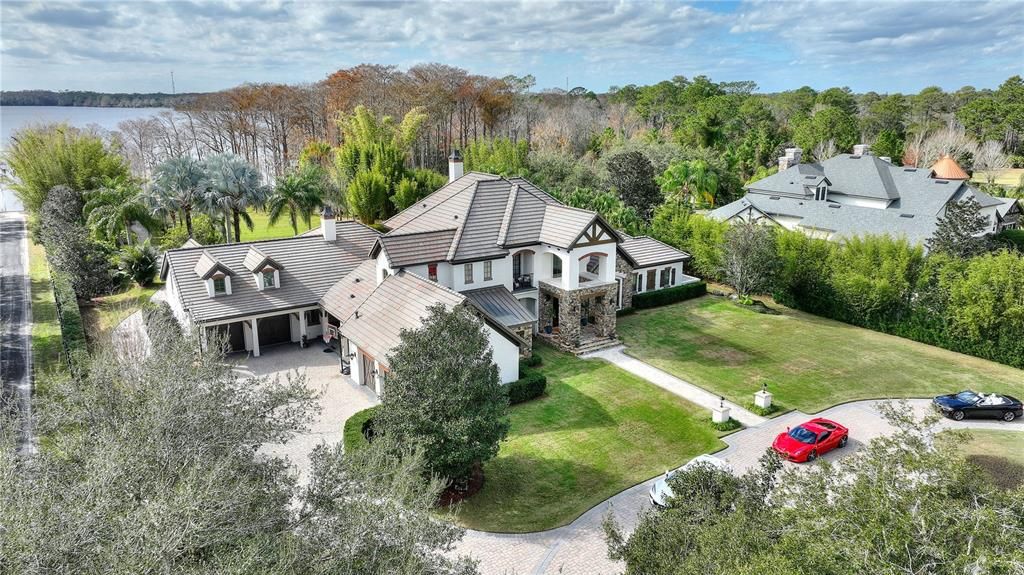 Named "Millionaires Cove," this Tudor Tuscan marvel blends Balinese and Indian influences. The gated community, housing only 29 residences, with 10 enjoying private lake access, ensures exclusive serenity.