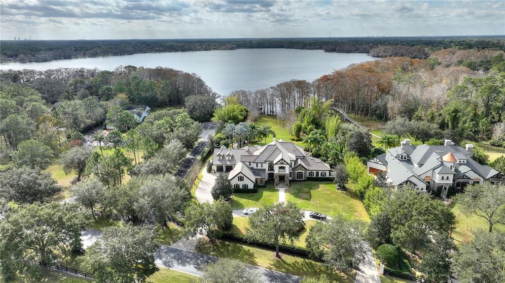 Named "Millionaires Cove," this Tudor Tuscan marvel blends Balinese and Indian influences. The gated community, housing only 29 residences, with 10 enjoying private lake access, ensures exclusive serenity.