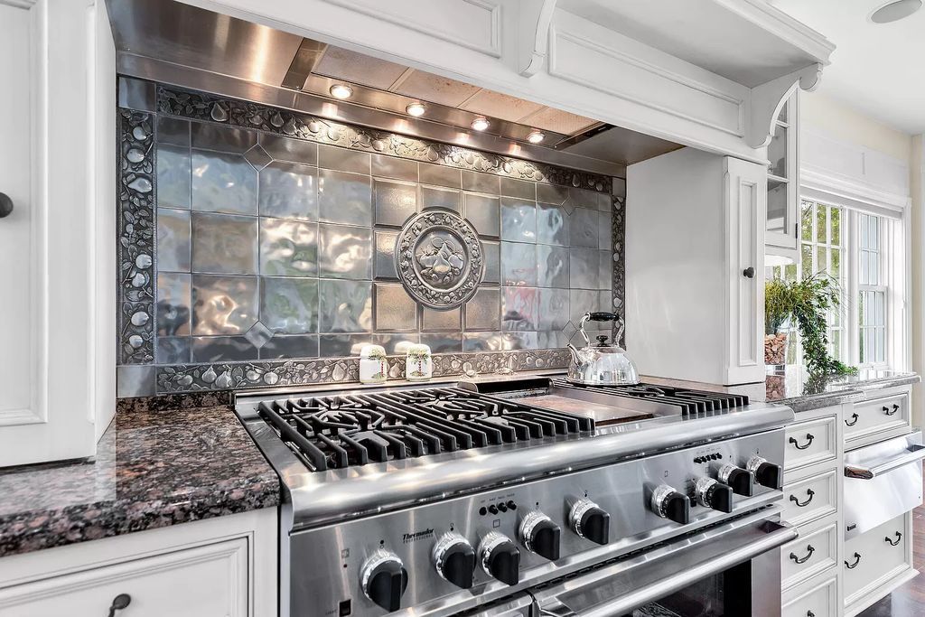 Experience the epitome of luxury island living at this exquisite Luxury Oceanfront Estate in Islamorada. Nestled on 10.85 acres along the Atlantic Ocean, this 2006-built property offers 450 feet of pristine beachfront accessed through a private, gated entrance.