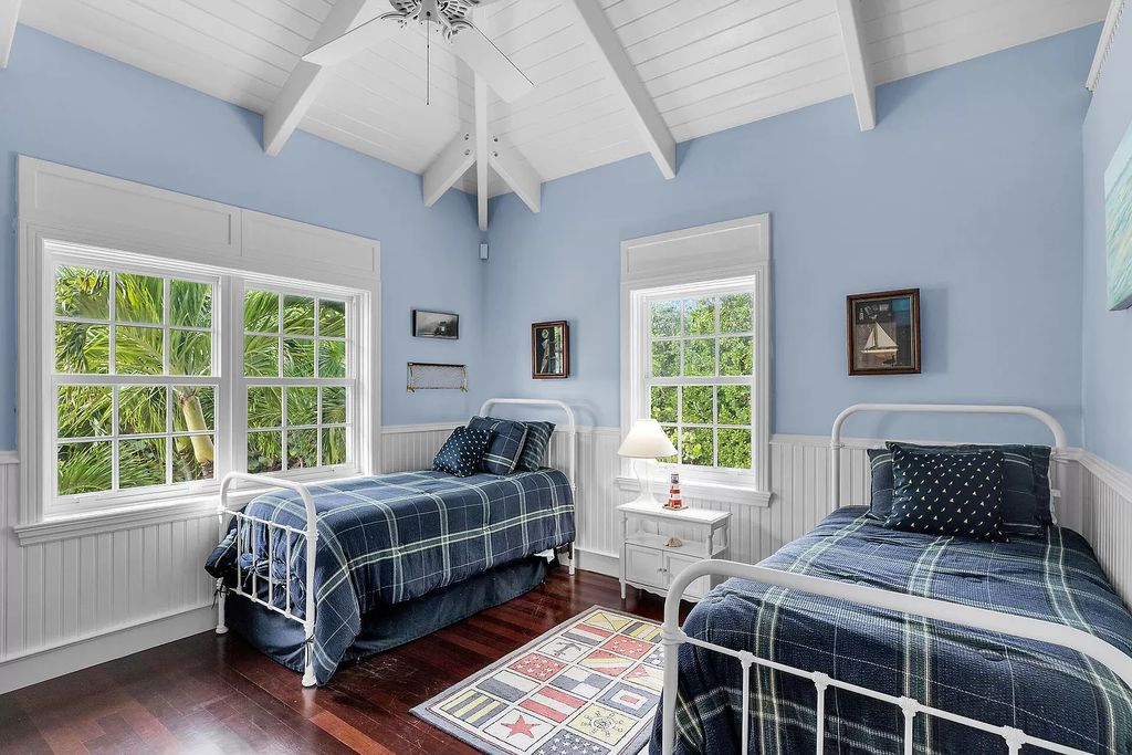 Experience the epitome of luxury island living at this exquisite Luxury Oceanfront Estate in Islamorada. Nestled on 10.85 acres along the Atlantic Ocean, this 2006-built property offers 450 feet of pristine beachfront accessed through a private, gated entrance.