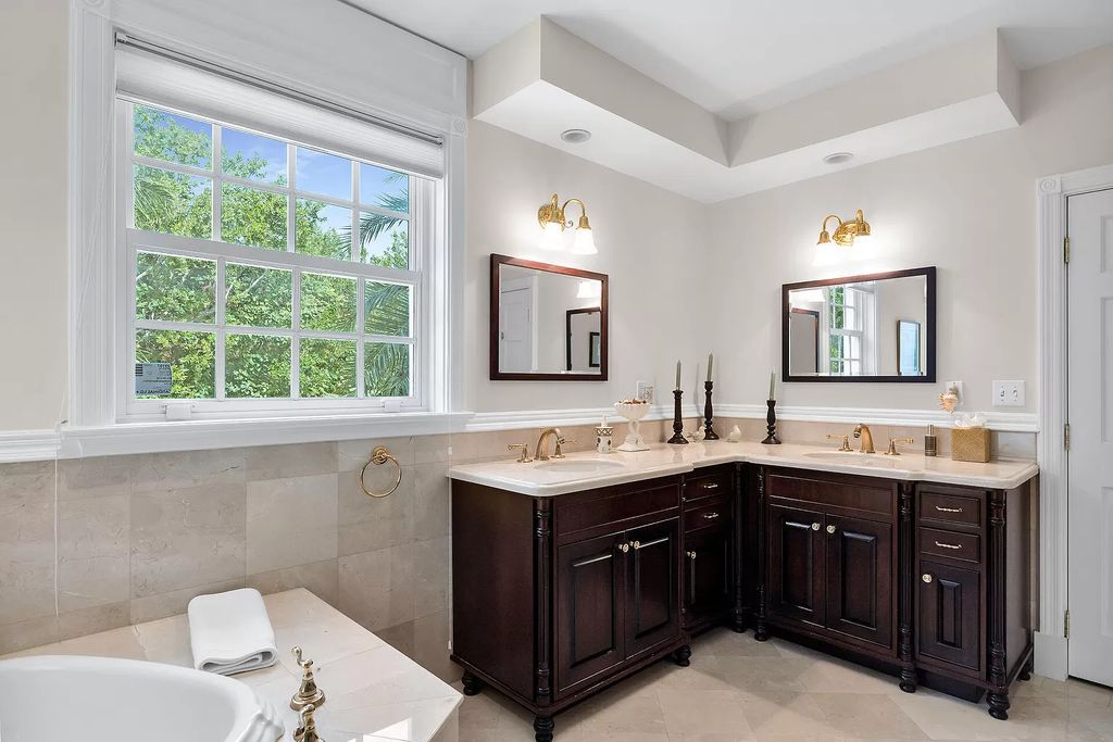 Experience the epitome of luxury island living at this exquisite Luxury Oceanfront Estate in Islamorada. Nestled on 10.85 acres along the Atlantic Ocean, this 2006-built property offers 450 feet of pristine beachfront accessed through a private, gated entrance.