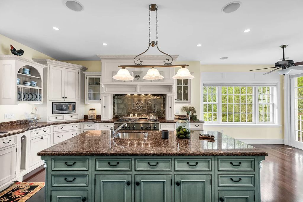 Experience the epitome of luxury island living at this exquisite Luxury Oceanfront Estate in Islamorada. Nestled on 10.85 acres along the Atlantic Ocean, this 2006-built property offers 450 feet of pristine beachfront accessed through a private, gated entrance.