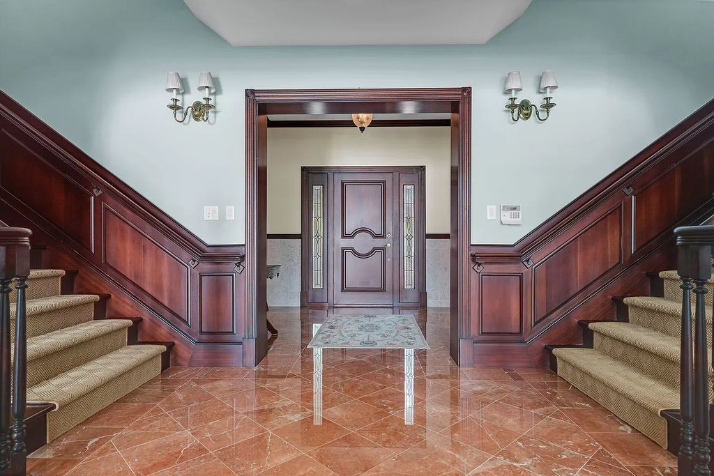 Experience the epitome of luxury island living at this exquisite Luxury Oceanfront Estate in Islamorada. Nestled on 10.85 acres along the Atlantic Ocean, this 2006-built property offers 450 feet of pristine beachfront accessed through a private, gated entrance.