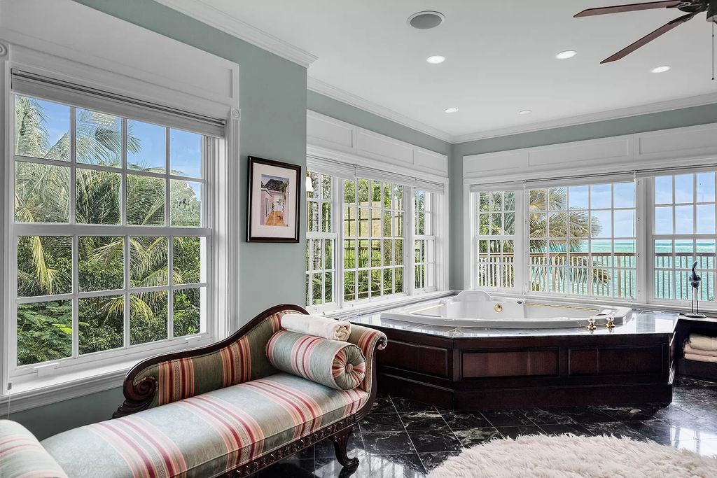 Experience the epitome of luxury island living at this exquisite Luxury Oceanfront Estate in Islamorada. Nestled on 10.85 acres along the Atlantic Ocean, this 2006-built property offers 450 feet of pristine beachfront accessed through a private, gated entrance.