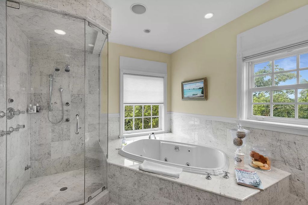 Experience the epitome of luxury island living at this exquisite Luxury Oceanfront Estate in Islamorada. Nestled on 10.85 acres along the Atlantic Ocean, this 2006-built property offers 450 feet of pristine beachfront accessed through a private, gated entrance.