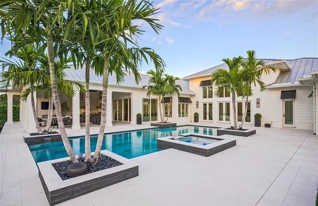 This sprawling 7,200 square feet single-story masterpiece in Pine Ridge epitomizes luxury living. With 6 bedrooms, a den, and a 6-car garage on a 1.31-acre lot, it boasts a wood-paneled library, a soaring two-story living room, and a gourmet kitchen with Wolf and Sub-Zero appliances.