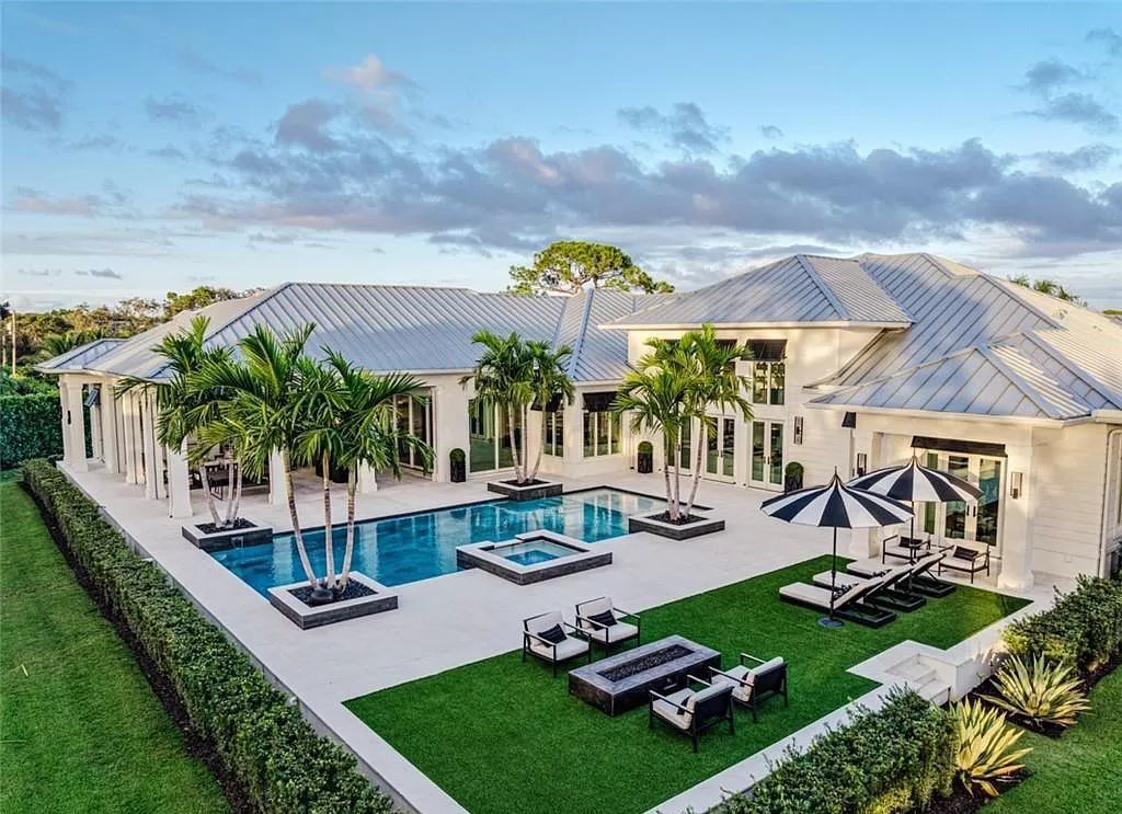 This sprawling 7,200 square feet single-story masterpiece in Pine Ridge epitomizes luxury living. With 6 bedrooms, a den, and a 6-car garage on a 1.31-acre lot, it boasts a wood-paneled library, a soaring two-story living room, and a gourmet kitchen with Wolf and Sub-Zero appliances.