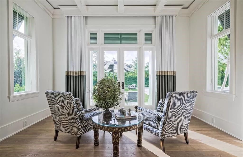 This sprawling 7,200 square feet single-story masterpiece in Pine Ridge epitomizes luxury living. With 6 bedrooms, a den, and a 6-car garage on a 1.31-acre lot, it boasts a wood-paneled library, a soaring two-story living room, and a gourmet kitchen with Wolf and Sub-Zero appliances.