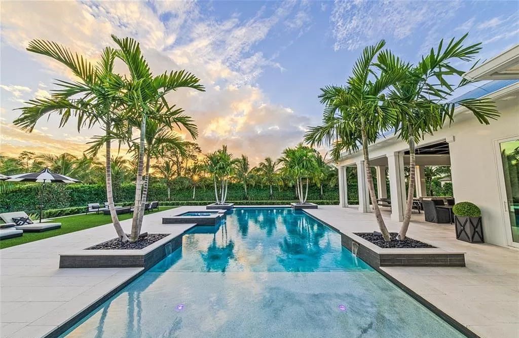 This sprawling 7,200 square feet single-story masterpiece in Pine Ridge epitomizes luxury living. With 6 bedrooms, a den, and a 6-car garage on a 1.31-acre lot, it boasts a wood-paneled library, a soaring two-story living room, and a gourmet kitchen with Wolf and Sub-Zero appliances.