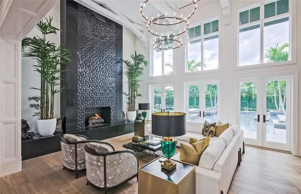 This sprawling 7,200 square feet single-story masterpiece in Pine Ridge epitomizes luxury living. With 6 bedrooms, a den, and a 6-car garage on a 1.31-acre lot, it boasts a wood-paneled library, a soaring two-story living room, and a gourmet kitchen with Wolf and Sub-Zero appliances.