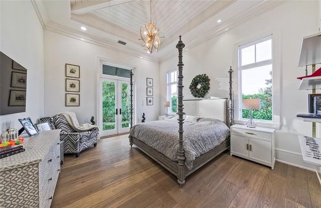 This sprawling 7,200 square feet single-story masterpiece in Pine Ridge epitomizes luxury living. With 6 bedrooms, a den, and a 6-car garage on a 1.31-acre lot, it boasts a wood-paneled library, a soaring two-story living room, and a gourmet kitchen with Wolf and Sub-Zero appliances.
