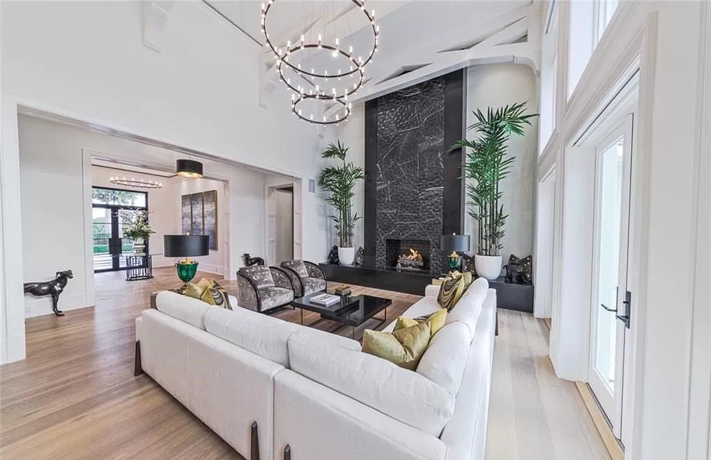 This sprawling 7,200 square feet single-story masterpiece in Pine Ridge epitomizes luxury living. With 6 bedrooms, a den, and a 6-car garage on a 1.31-acre lot, it boasts a wood-paneled library, a soaring two-story living room, and a gourmet kitchen with Wolf and Sub-Zero appliances.