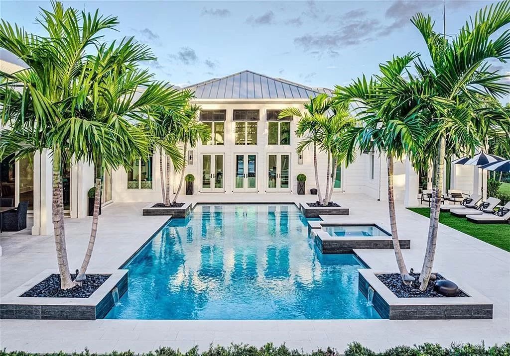This sprawling 7,200 square feet single-story masterpiece in Pine Ridge epitomizes luxury living. With 6 bedrooms, a den, and a 6-car garage on a 1.31-acre lot, it boasts a wood-paneled library, a soaring two-story living room, and a gourmet kitchen with Wolf and Sub-Zero appliances.