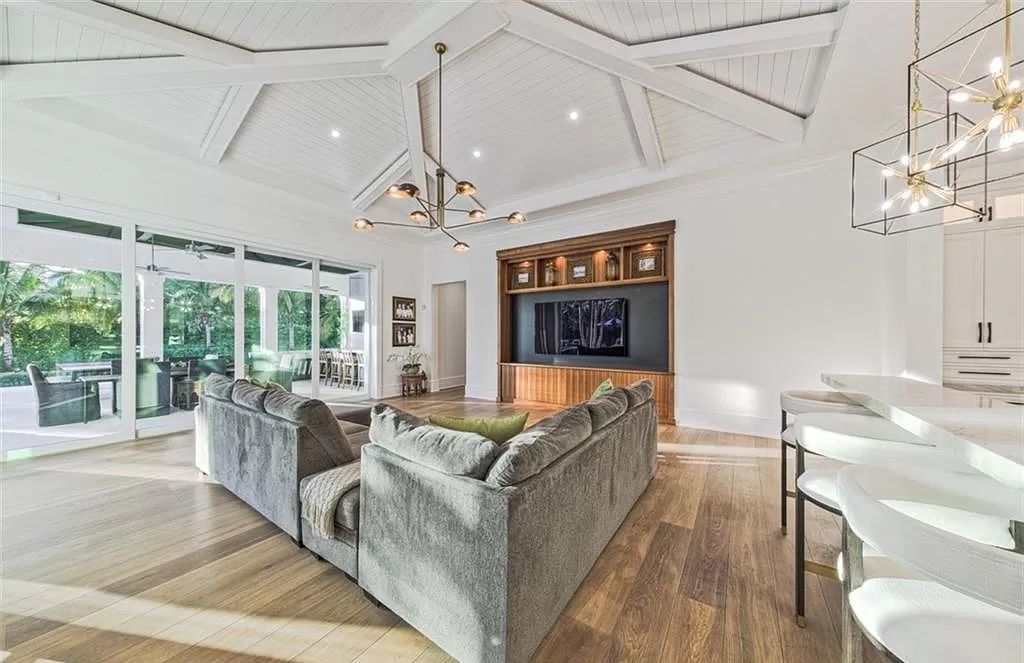 This sprawling 7,200 square feet single-story masterpiece in Pine Ridge epitomizes luxury living. With 6 bedrooms, a den, and a 6-car garage on a 1.31-acre lot, it boasts a wood-paneled library, a soaring two-story living room, and a gourmet kitchen with Wolf and Sub-Zero appliances.