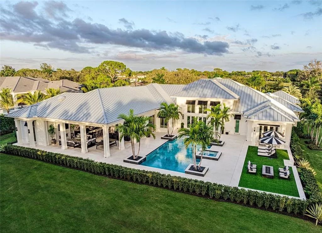 This sprawling 7,200 square feet single-story masterpiece in Pine Ridge epitomizes luxury living. With 6 bedrooms, a den, and a 6-car garage on a 1.31-acre lot, it boasts a wood-paneled library, a soaring two-story living room, and a gourmet kitchen with Wolf and Sub-Zero appliances.