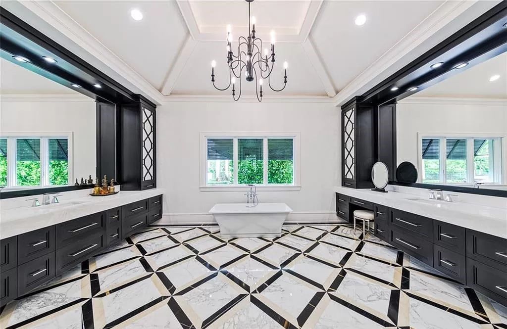 This sprawling 7,200 square feet single-story masterpiece in Pine Ridge epitomizes luxury living. With 6 bedrooms, a den, and a 6-car garage on a 1.31-acre lot, it boasts a wood-paneled library, a soaring two-story living room, and a gourmet kitchen with Wolf and Sub-Zero appliances.