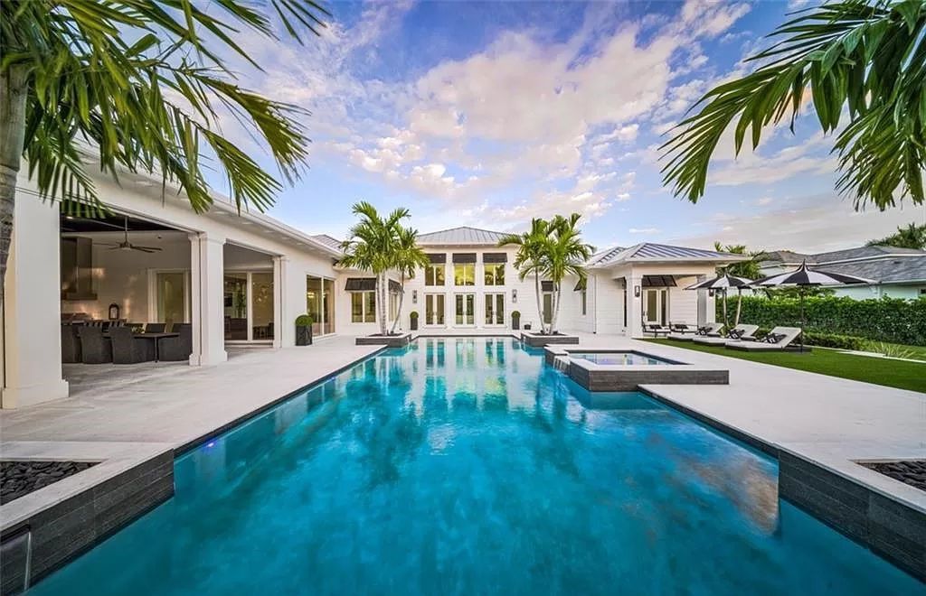 This sprawling 7,200 square feet single-story masterpiece in Pine Ridge epitomizes luxury living. With 6 bedrooms, a den, and a 6-car garage on a 1.31-acre lot, it boasts a wood-paneled library, a soaring two-story living room, and a gourmet kitchen with Wolf and Sub-Zero appliances.