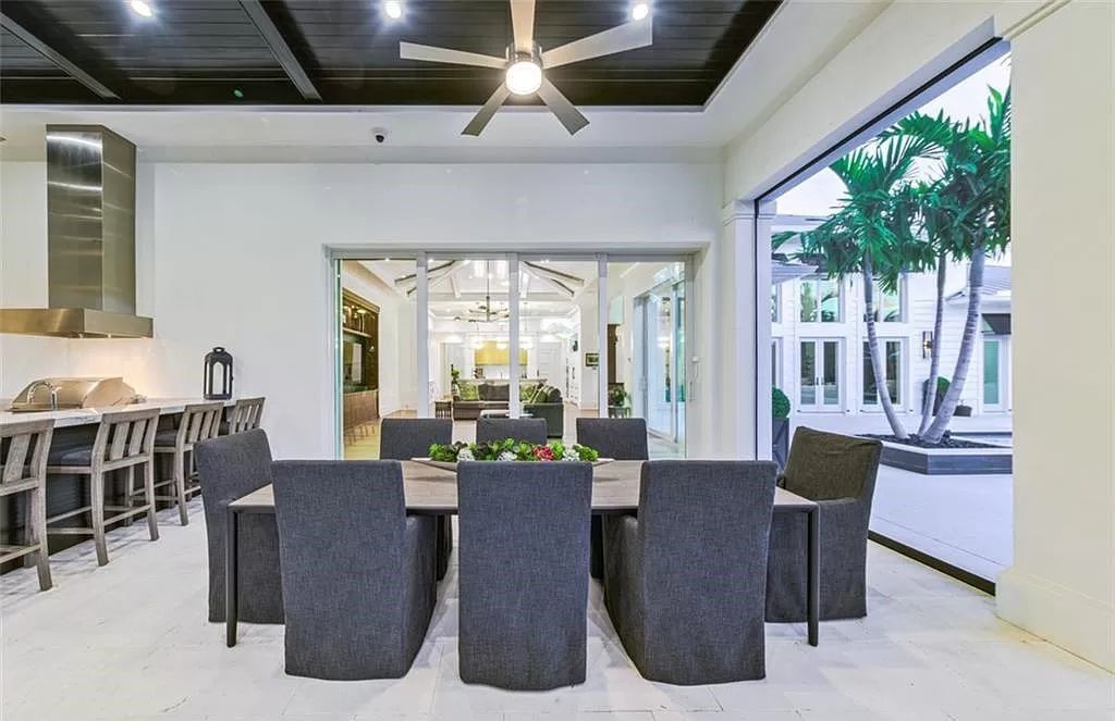 This sprawling 7,200 square feet single-story masterpiece in Pine Ridge epitomizes luxury living. With 6 bedrooms, a den, and a 6-car garage on a 1.31-acre lot, it boasts a wood-paneled library, a soaring two-story living room, and a gourmet kitchen with Wolf and Sub-Zero appliances.