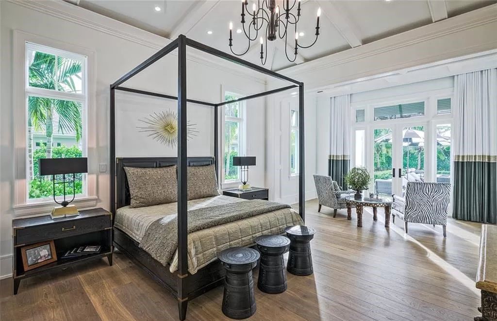 This sprawling 7,200 square feet single-story masterpiece in Pine Ridge epitomizes luxury living. With 6 bedrooms, a den, and a 6-car garage on a 1.31-acre lot, it boasts a wood-paneled library, a soaring two-story living room, and a gourmet kitchen with Wolf and Sub-Zero appliances.