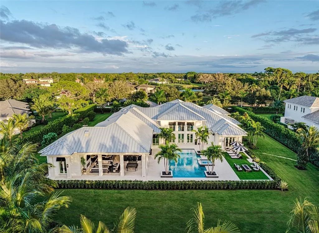 This sprawling 7,200 square feet single-story masterpiece in Pine Ridge epitomizes luxury living. With 6 bedrooms, a den, and a 6-car garage on a 1.31-acre lot, it boasts a wood-paneled library, a soaring two-story living room, and a gourmet kitchen with Wolf and Sub-Zero appliances.
