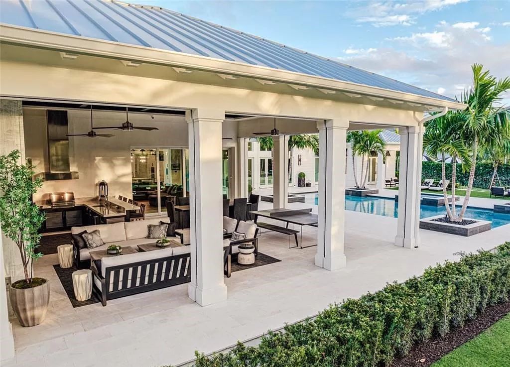 This sprawling 7,200 square feet single-story masterpiece in Pine Ridge epitomizes luxury living. With 6 bedrooms, a den, and a 6-car garage on a 1.31-acre lot, it boasts a wood-paneled library, a soaring two-story living room, and a gourmet kitchen with Wolf and Sub-Zero appliances.