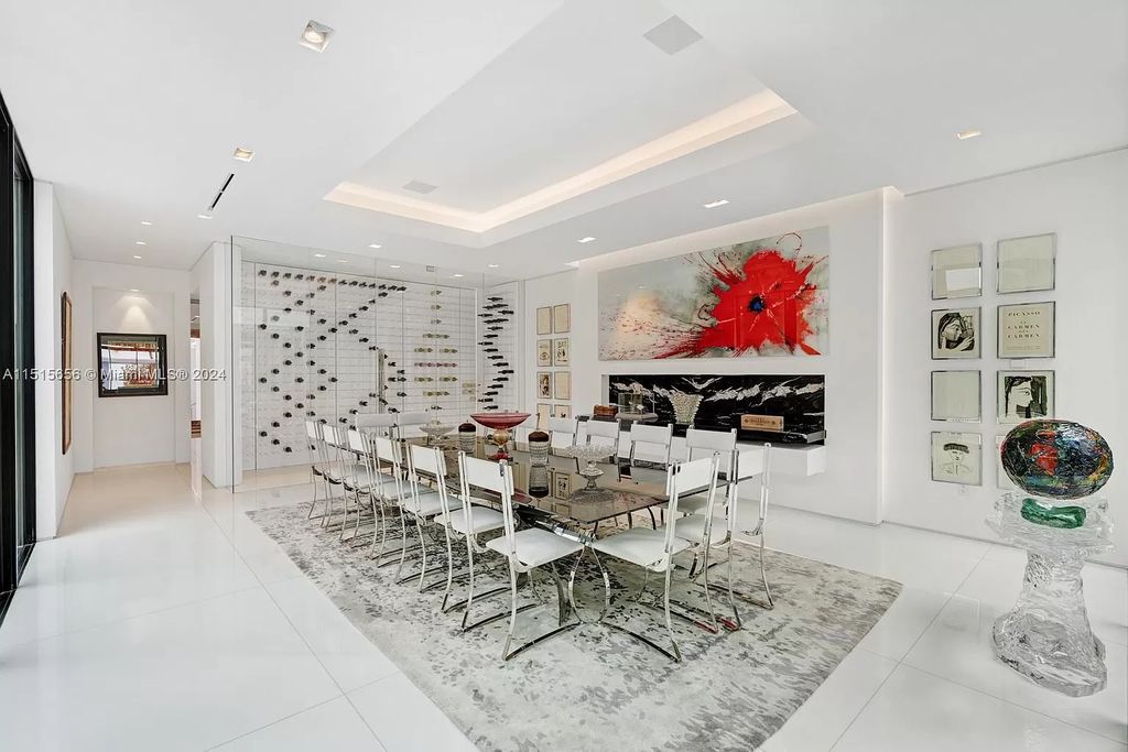 Welcome to 5004 N Bay Rd, a 2016 masterpiece by renowned designer Jennifer Post, blending modern architecture with timeless elegance. This 8-bed, 9-bath waterfront haven on prestigious North Bay Road boasts a stunning atrium courtyard, seamless living spaces, and a gourmet kitchen.
