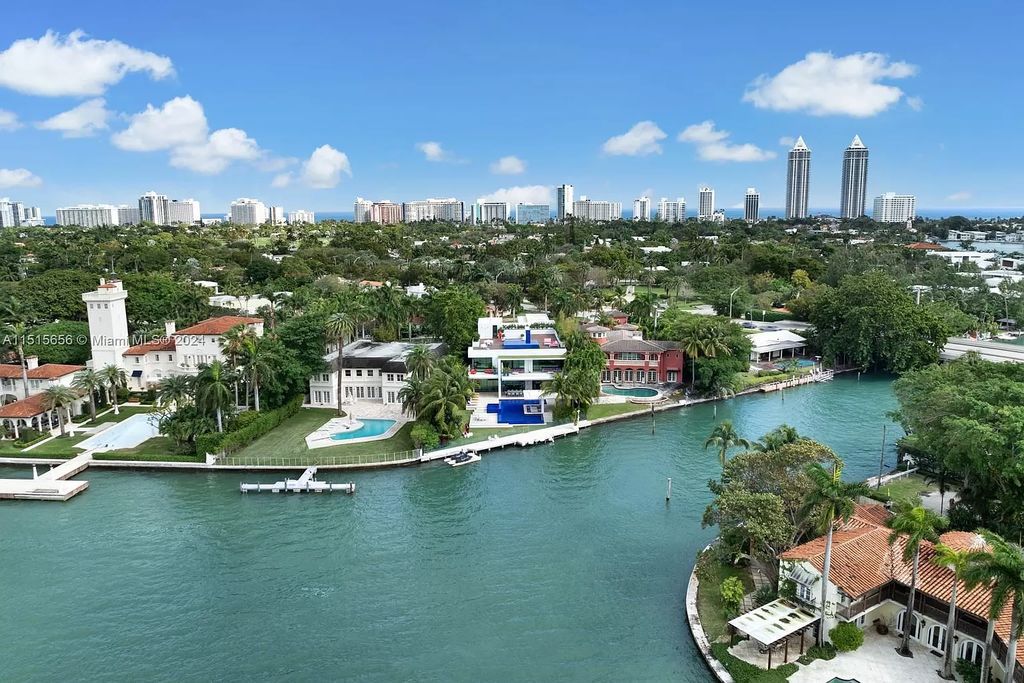 Welcome to 5004 N Bay Rd, a 2016 masterpiece by renowned designer Jennifer Post, blending modern architecture with timeless elegance. This 8-bed, 9-bath waterfront haven on prestigious North Bay Road boasts a stunning atrium courtyard, seamless living spaces, and a gourmet kitchen.