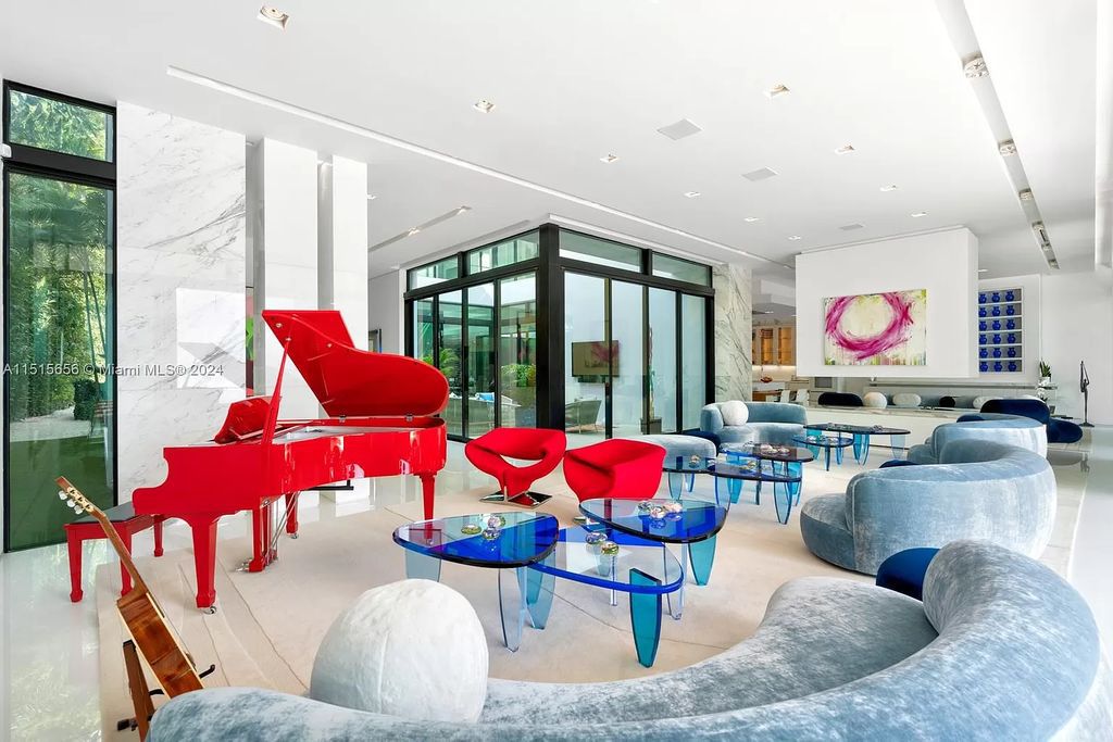 Welcome to 5004 N Bay Rd, a 2016 masterpiece by renowned designer Jennifer Post, blending modern architecture with timeless elegance. This 8-bed, 9-bath waterfront haven on prestigious North Bay Road boasts a stunning atrium courtyard, seamless living spaces, and a gourmet kitchen.