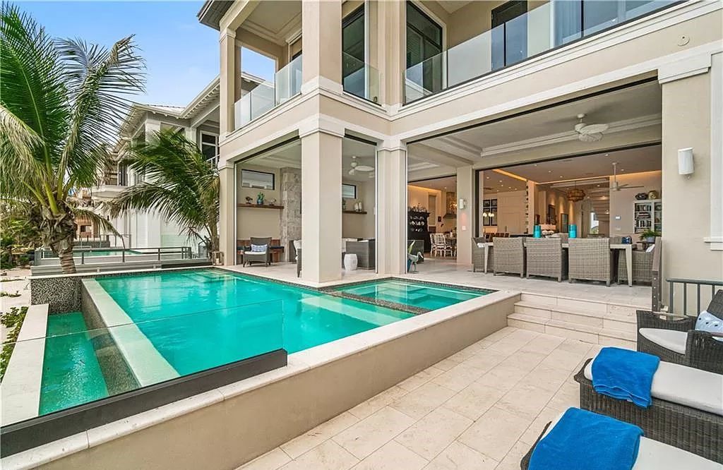 Welcome to 26854 Hickory Blvd, a 5-bed/5-bath beachfront masterpiece in Bonita Springs, FL. Built by Potter Homes and designed by Kukk Architects in 2017, this 4,647 square feet home boasts spectacular Gulf views from every floor.
